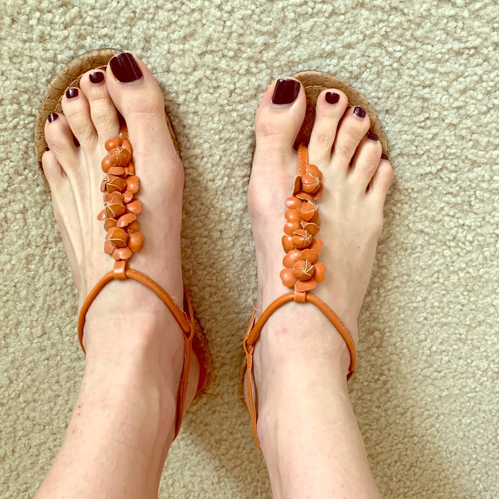 Coral/orange sandals with about a 1” wedge.